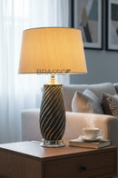 Pair of ceramic linner-style table lamps designed for modern bedside and interior decor lighting.