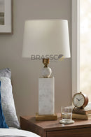 Set of two white marble cylinder table lamps for stylish bedroom and living room illumination.